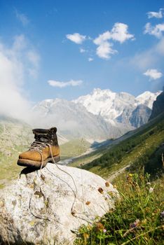 Vintage climber boot is being dried in the base camp in Caucasian mountains
