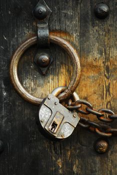 Heavy wooden doors with chains and padlocks are all about security