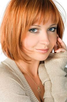 Beautiful red haired girl isolated on white background