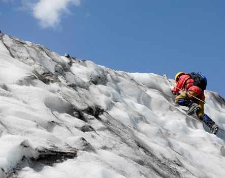 Mountaineer makes his way up to the top