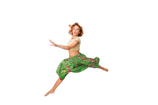 Beautiful girl jumping high isolated on white