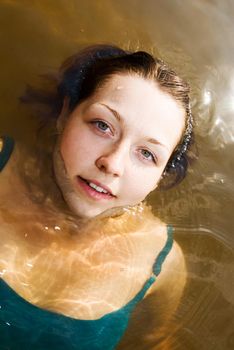 Beautiful young girl on a water therapy session