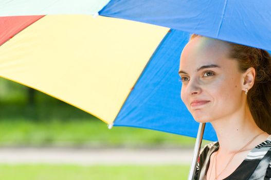 Young female with colorful umbrella