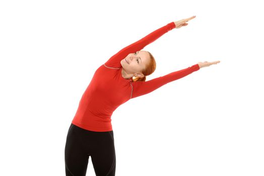 Beautiful young red woman performing fitness exercises over white background