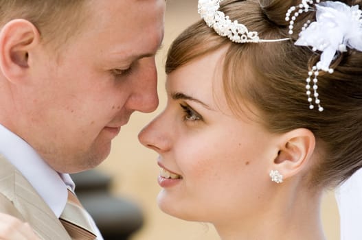 Newlyweds looking at each other after a wedding ceremony.