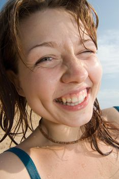 Cheerful red haired girl winking
