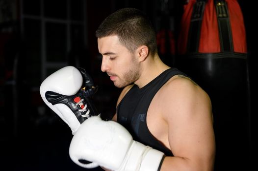 Confident boxer standing in pose and ready to fight. High quality photo