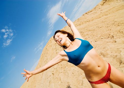 Young healthy-looking girl is excited about summer on a beach