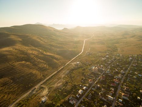 Late summer sunset aerial landscape in Crimea mountains near Black Sea