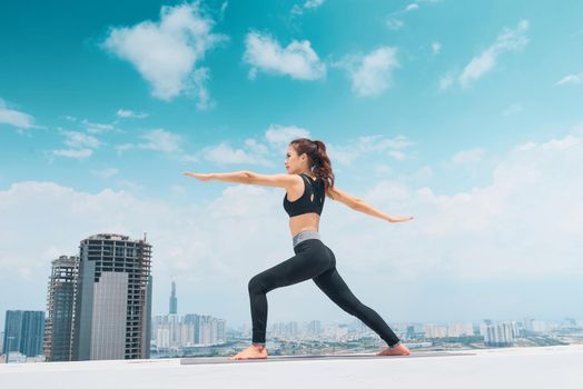 Young asian woman in sport wear doing sports outdoors