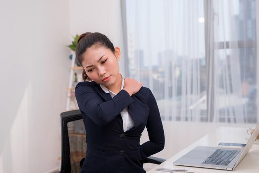 Businesswoman leading sedentary lifestyle causing back pain