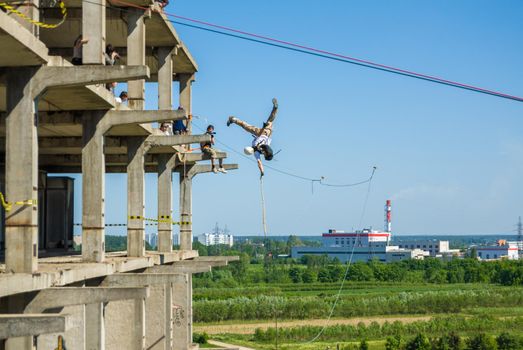 MOSCOW, RUSSIA - June 3, 2007 - People at extreme sports Ropejumping event. Group of rope jumpers organize such events for people seeking to bring a dose of adrenaline in their life