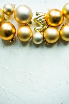 Christmas card concept with variety of holiday festive balls on concrete background