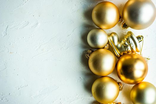 Christmas card concept with variety of holiday festive balls on concrete background