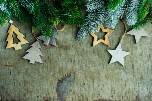 Christmas card concept with wooden xmas decoration on vintage background