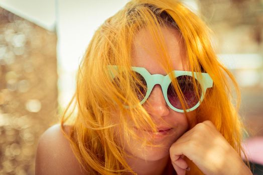 Red haired woman in beach cafe. Egypt resort tourism theme