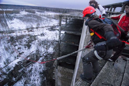 ZHELEZNODOROZHNIY, RUSSIA - March 2, 2008 - Rope jumping event held at the abandoned building construction site. Sports enthusiast groups organize such events for adrenaline lovers from all over Moscow district