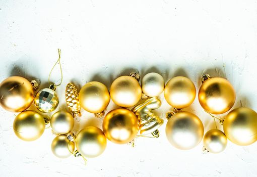 Christmas card concept with variety of holiday festive balls on concrete background