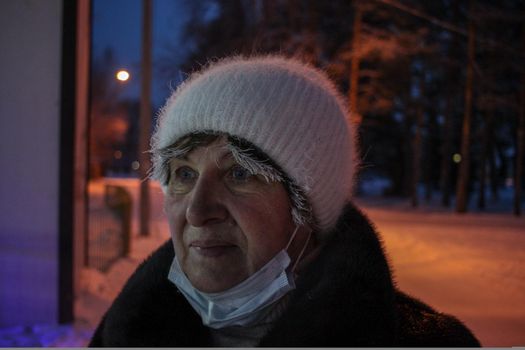 Adult woman in a hat on the street