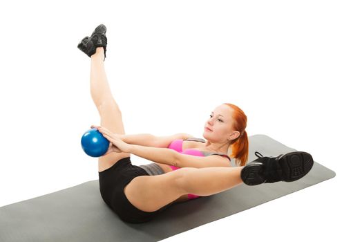 Young slim sensual red woman wearing sports bra practicing fitness