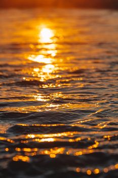 Colorful ocean beach sunrise with deep blue sky and sun rays. High quality photo