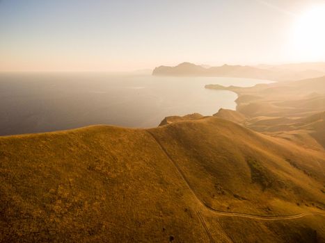 Late summer sunset aerial landscape in Crimea mountains near Black Sea