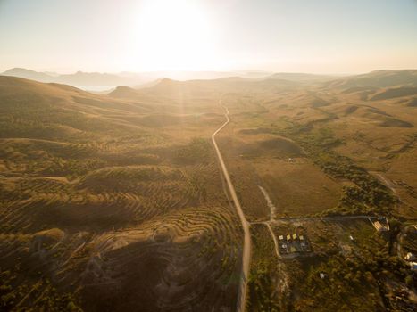 Late summer sunset aerial landscape in Crimea mountains near Black Sea