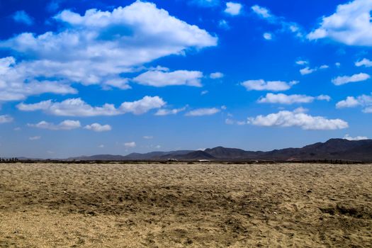 Beautiful view of Salinas beach in Cabo de Gata with mountains in the background
