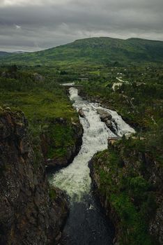 Vøringsfossen - Vøring Falls -  is located in Eidfjord, Hardanger, at the top of Måbødalen. The falls is one of the most popular and visited attraction in Norway. It is possible to see the falls from above, or even after a short hiking it is possible to witness the falls from below. Either way, it is one of the most spectacular experience one will have visiting Norway.