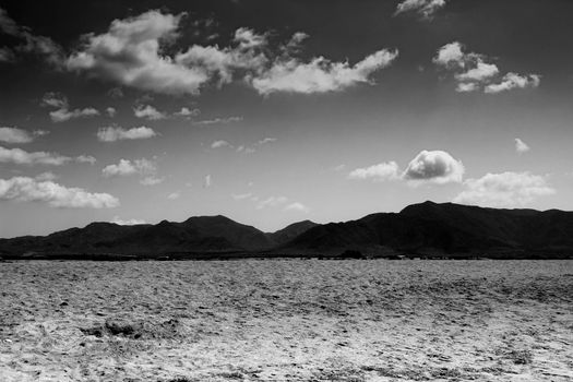 Beautiful view of Salinas beach in Cabo de Gata with mountains in the background
