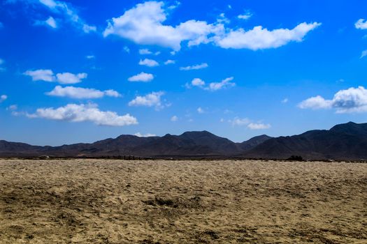 Beautiful view of Salinas beach in Cabo de Gata with mountains in the background