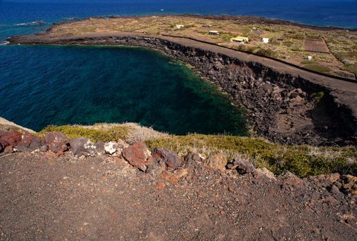 View of the scenic lava rock cliff in the Linosa island. Sicily