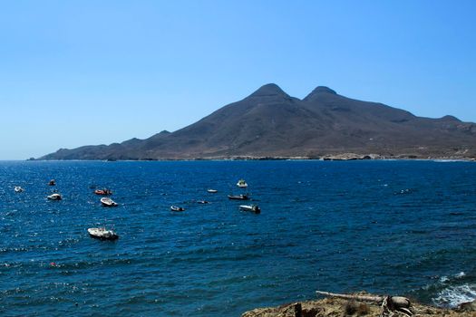 Beautiful seascape in Isleta del Moro village. Volcanous in the background.