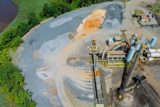 Aerial view of open cast mining panorama quarry with work of machinery equipment at a quarries