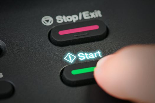 Close-up hand button start mission.
