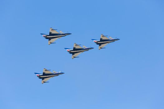 Nakhonratchasima, THAILAND November 26, 2015 : F16 Gripen and August 1st Aerobatic team" engaged in acrobatics.