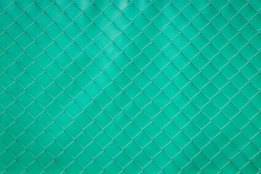 Steel mesh rusty on green background.