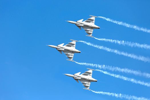 Nakhonratchasima, THAILAND November 27, 2015 : F16 Gripen and August 1st Aerobatic team" engaged in acrobatics.