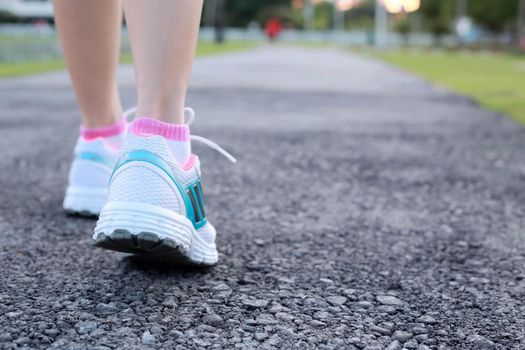 Close-up women jogging at  public park in the morning.