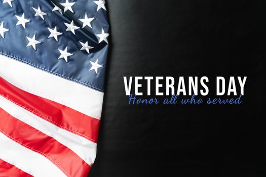 Veterans day. Honoring all who served. American flag on black background.
