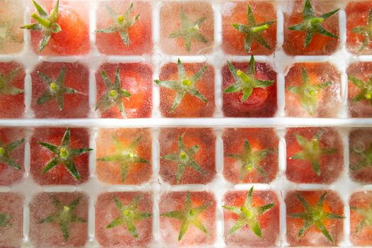 Photographic presentation of the preparation of small frozen Pachino tomatoes in small cubes for the preparation of refreshing aperitifs. 