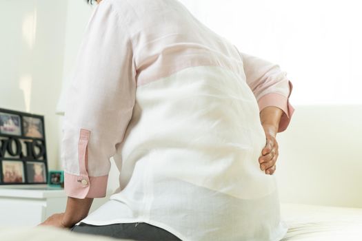 Back pain of old woman at home, healthcare problem of senior concept