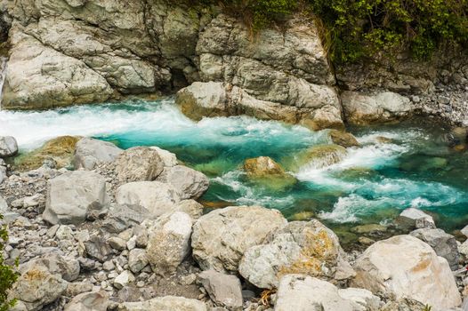 Beautiful turquoise creek near the Milford highway. Fiordland National Park, New Zealand