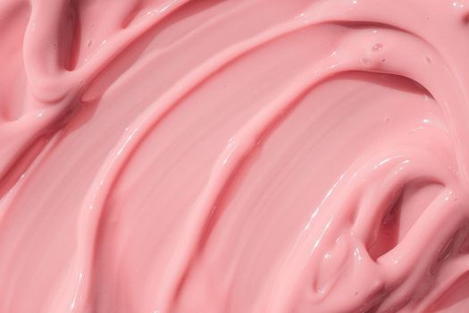 Beauty creme smear background. Pink cosmetic cream lotion moisturizer texture smudge sample. Skin care product strokes closeup. Creamy textured backdrop. Macro, close up