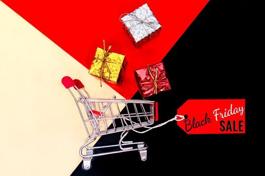 Black Friday sale concept, shopping cart and gift box, year-end sale