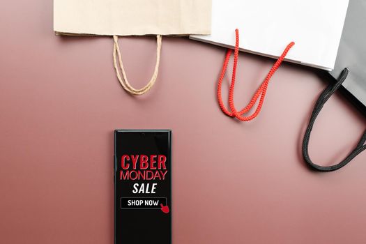 Cyber Monday Sale Clearance Discount Concept, smartphone with shopping bag.