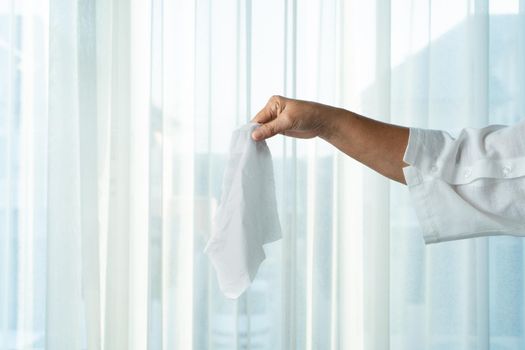 Senior women hand holding napkin/tissue paper