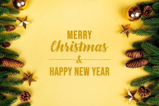 Christmas background, pine tree with xmas decoration on yellow background