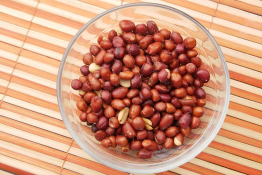 Processed pea nuts in a bowl on table top down