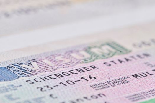 Tashkent, Uzbekistan - 13 August, 2021: Schengen visa in passport. Close-up. Macro shot. Visa stamp in the passport. Schengen visa for tourism and travel in EU